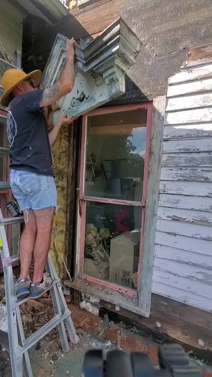 Nate working on the exterior trim, a constant project at a house this old